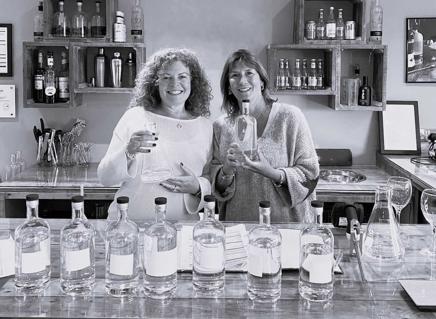Gin owners showcasing their premium gin, reflecting their passion and craftsmanship – Say it with Gin