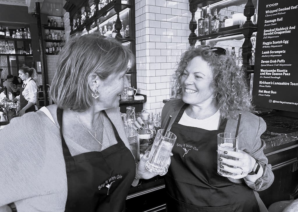 Gin owners showcasing their premium gin, reflecting their passion and craftsmanship – Say it with Gin