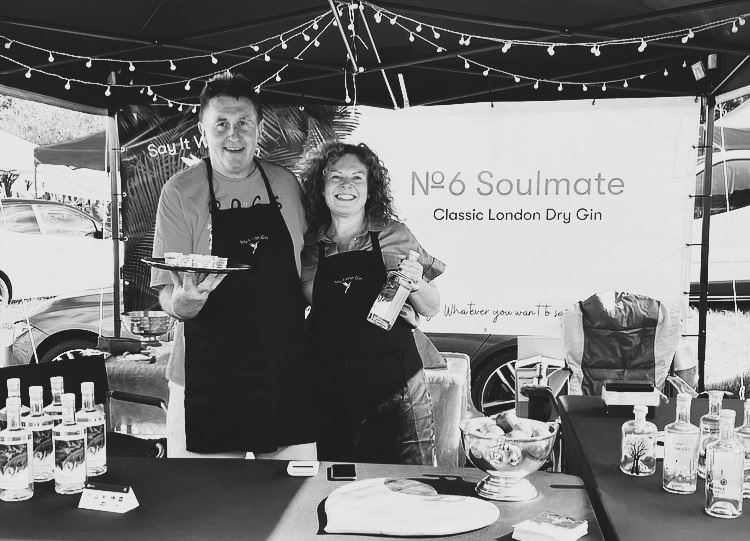 Gin owners showcasing their premium gin, reflecting their passion and craftsmanship – Say it with Gin